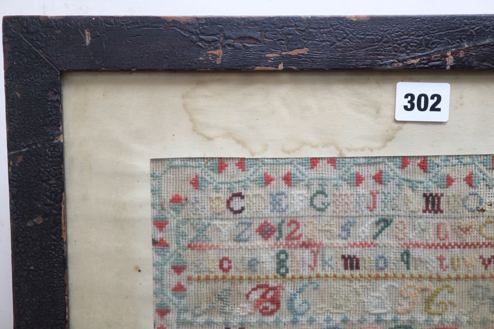 A needlework sampler dated 1886, framed as a firescreen, overall height 71cm